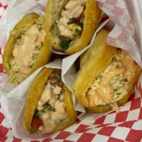 Roasted Pork Arepa (ea) · Slow roasted pork topped with green onions and house sauce.