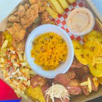 Fritanga Box · Tostones, arroz con gandules, yuquita frita, chicharrones de pollo, carne de cero frita, pap...