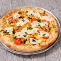 Caprese White Pizza · Fresh tomatoes, fresh mozzarella, basil and garlic.