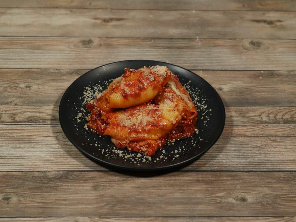 Stuffed Shells · Freshly made shells stuffed with mozzarella cheese. Served with garlic bread.