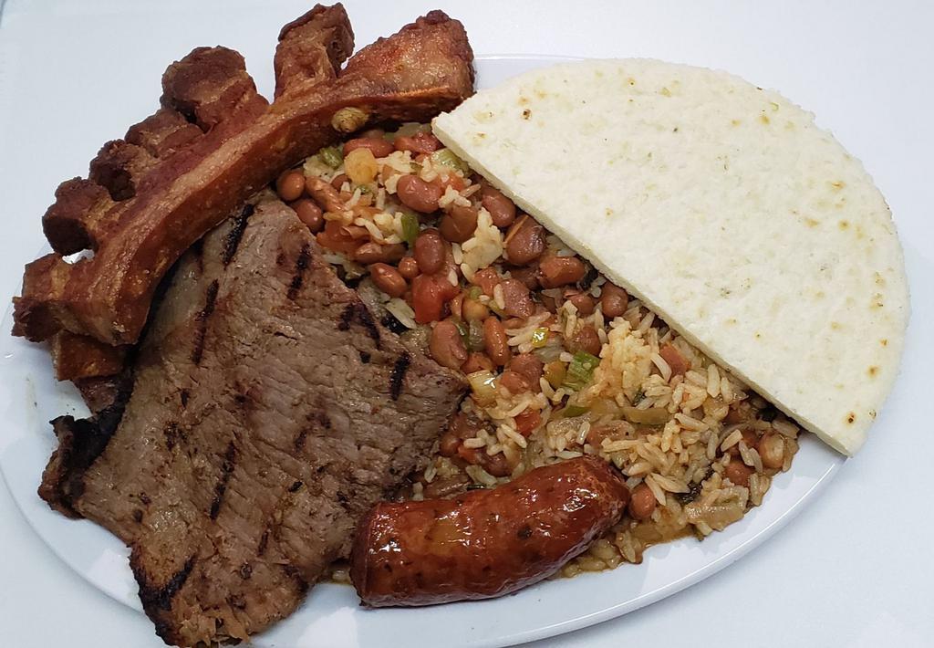 #7. Calentado Mixto · Re-fried beans with  grilled steak or grilled chicken, sausage and pork skin.