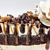 Turtle Brownie Cheesecake · Enjoy our original creamy cheesecake with a layer of moist brownie. Topped with brownie bits...