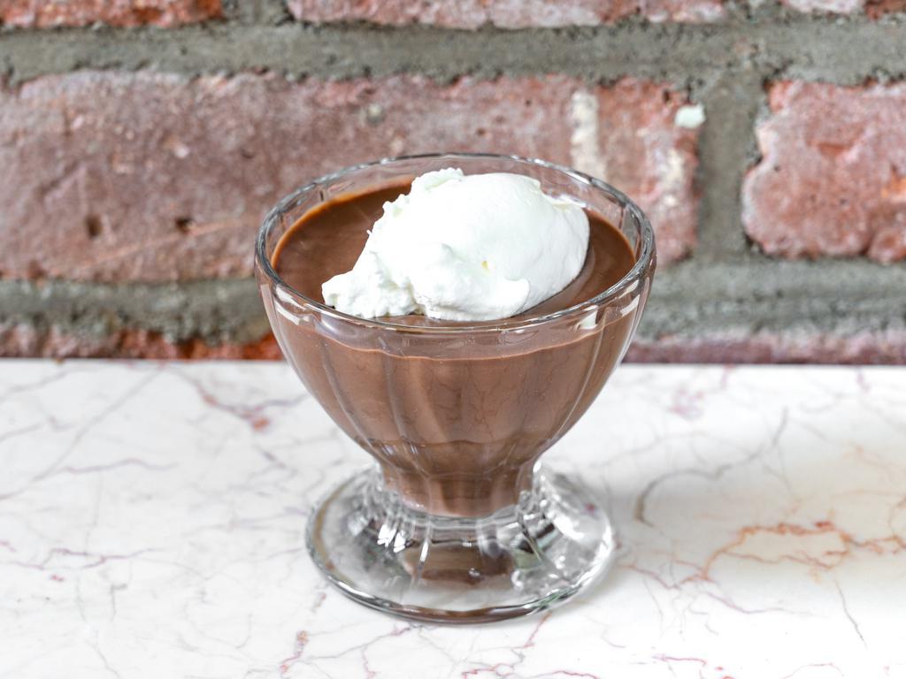 The Chocolate Room Pudding · A classic favorite made with semi sweet chocolate and topped with fresh whipped cream, and a chocolate tuile.