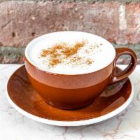 White Hot Chocolate · Belgian white chocolate blended with whole milk.  Topped with cinnamon, and a dollop of fres...