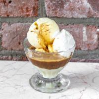 Affogato · Two small scoops of our homemade vanilla ice cream with a single scoop of espresso. Topped w...