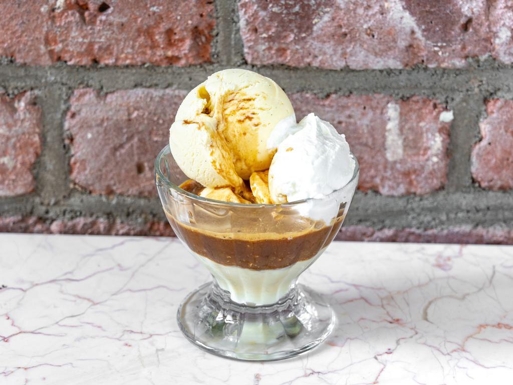 Affogato · Two small scoops of our homemade vanilla ice cream with a single scoop of espresso. Topped with fresh whipped cream.