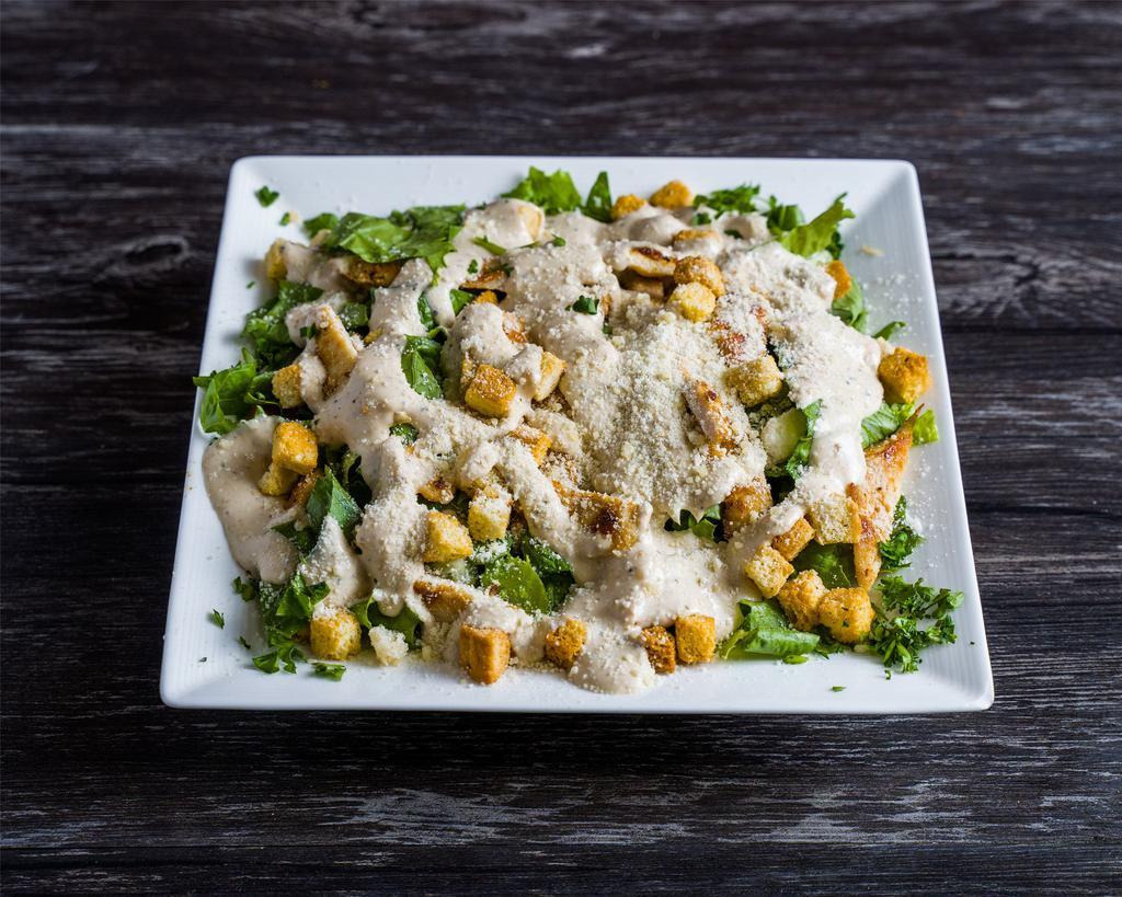 Caesar Salad · Lettuce, croutons, parmesan cheese grated or shaved and caesar dressing on top.