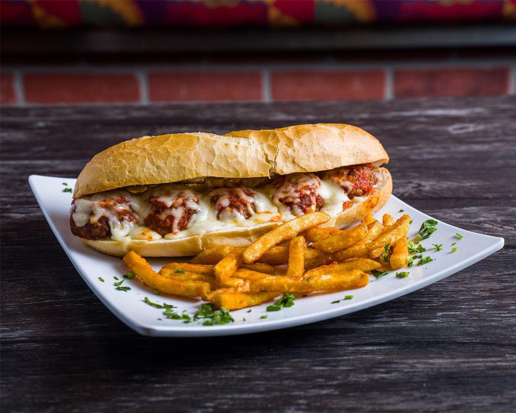 Meatballs Parmigiana Sandwich · Homemade Meatballs with homemade tomato sauce baked with mozzarella cheese.
