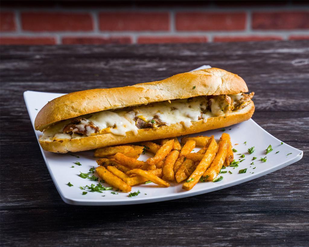 Philly Cheese Steak Sandwich · Thinly sliced beef with peppers, onions and baked with mozzarella cheese.