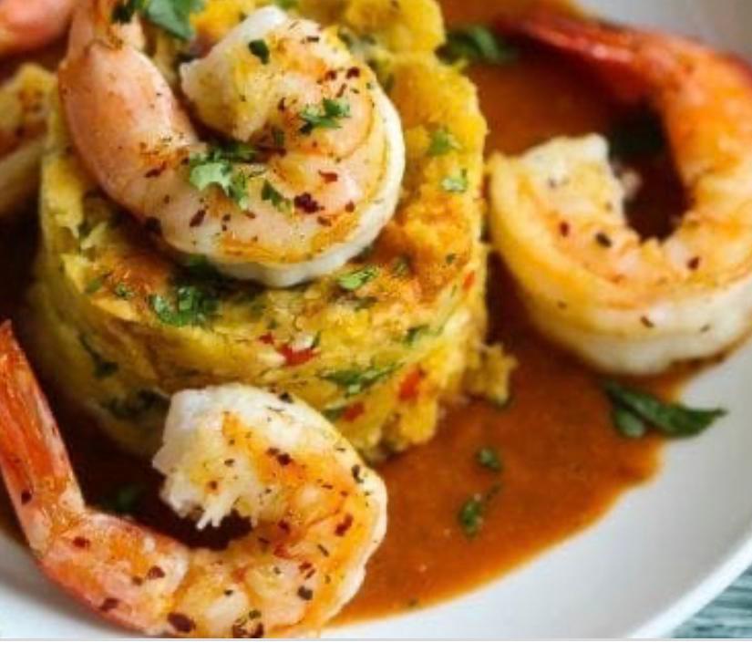 Mofongo de Camarones · Shrimp. Mofongo 
Mash green Platano with garlic and butter on 
Souse after and piece of shrimp on it and shrimp on the side make the perfect taste to blow ur mint 