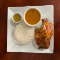 1/2 Pollo al Horno · 1/2 baked chicken with rice and beans.