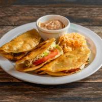 Fried Taco · 3 crispy taco filled with your choice of chicken, ground beef or shredded beef with salad an...