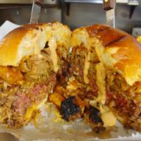 Porky Pickle Burger · A pepper jack burger topped with pulled pork, fried pickles and chipotle ranch. Served with ...