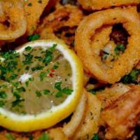 Fried Calamari · Lightly battered and fried to a tender, crisp, golden brown, served with marinara sauce.