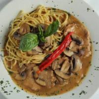 Veal Marsala · Medallions of veal with wild mushrooms sauteed in a Marsala wine sauce served with pasta.