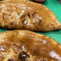 Three Cheese Calzone · Served with ricotta and mozzarella.