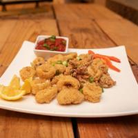 Calamari · Fresh calamari lightly dusted in our seasoned flour, served with warm marinara & fresh cut l...