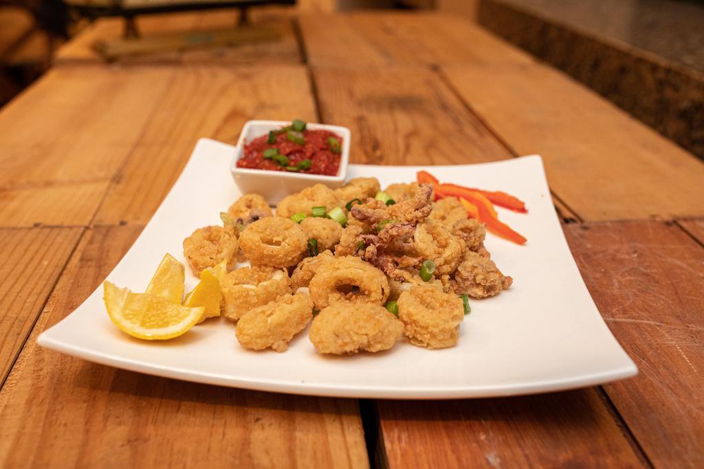 Calamari · Fresh calamari lightly dusted in our seasoned flour, served with warm marinara & fresh cut lemon wedges.