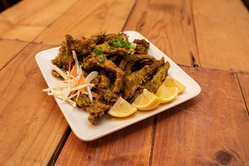 Caribbean Fried Fish (Bangamary) · Fresh catch seasoned fried snapper, pan tossed in our authentic sauces – choice of traditional fried, jerk, bbq, spicy garlic, hot, sweet chili.