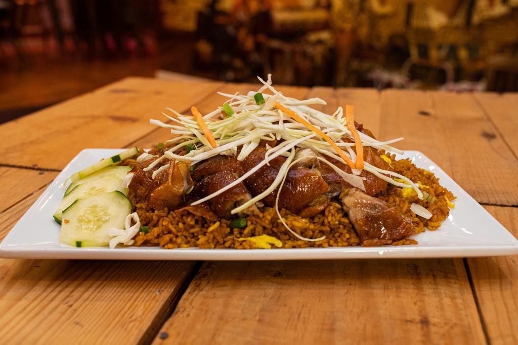 Roast Duck · Tender duck marinated with our Island blend of spices & flame roasted.