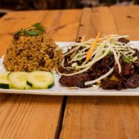 Jerk Lamb · Fire roasted lamb sautéed with our signature blend of Jamaican spices.