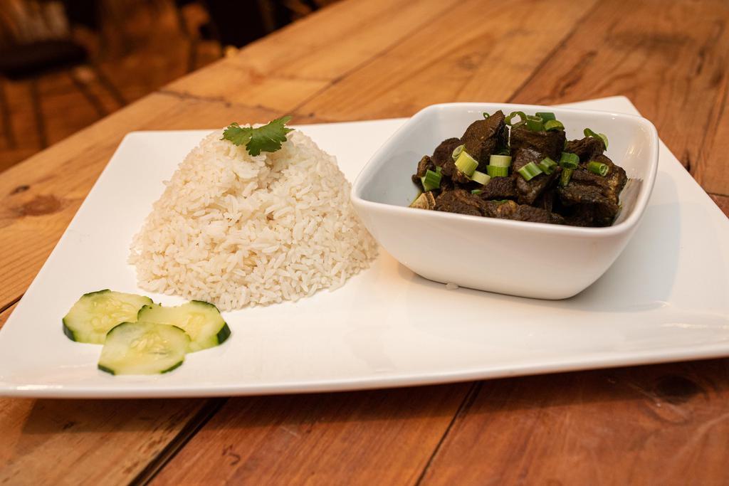 Curry Goat · Seasoned goat, slow simmered in our authentic Island curry sauce.
