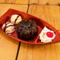 Sunken Chocolate Lava Boat · Warm rich, fudge filled chocolate molten lava cake drizzled with hershey’s chocolate syrup, ...