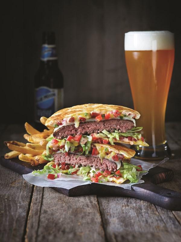 Quesadilla Burger · Part-burger, part quesadilla. This original burger creation comes piled high with two slices of Pepper Jack cheese, our signature Mexi-ranch sauce, crispy Applewood-smoked bacon, house-made pico de gallo and shredded lettuce in a crisp, warm Cheddar quesadilla.
