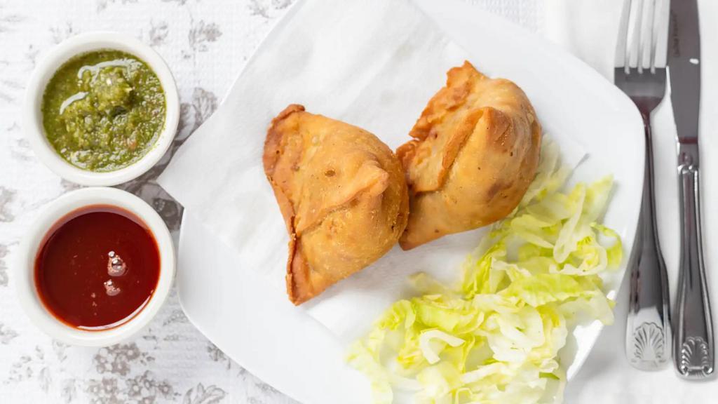 1. Vegetable Samosa · 2 pieces. Crispy turnover, delicious filled with mildly spices potatoes and green peas.