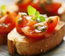 Bruschetta Tomato Basil and Onions · Grilled bread with toppings.
