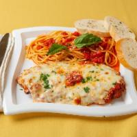 Chicken Parmigiana · Breaded chicken cutlet topped with marinara sauce and mozzarella.