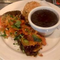 Bistec Encebollado · 8 oz. skirt steak, onions scallions and, tomatoes served with rice, black beans and, tortill...