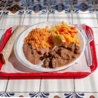 Carne Guisada Combo Plate · Beef tips, rice, beans, salad and 2 tortillas.