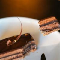 Chocolate Mousse · Hazelnut feuilletine praline crunch, flourless chocolate cake, dark chocolate cream, and dar...