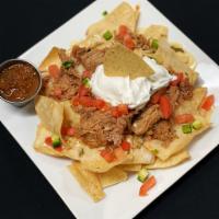 Pulled Pork Nachos · Crispy chips topped with pulled pork, queso, pico de gallo, sour cream, & a side of salsa.
P...