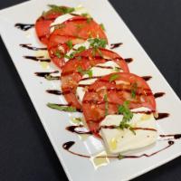 Caprese Salad · Fresh mozzarella, fresh tomato slices, and fresh basil topped with a light drizzle of olive ...