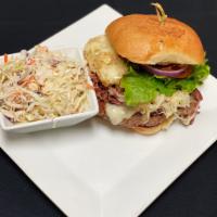The Liam Neeson Burger · A fresh 8 oz patty topped with house-made corned beef, sauerkraut, Swiss cheese, & Russian d...