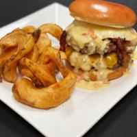 Tower of Power · Two half-pound patties, cheddar and American cheese, jalapeno bacon, an over-easy egg, and t...