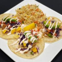 Grilled Mahi Mahi Tacos · Grilled Mahi Mahi tacos with mango salsa, shredded cabbage, & avocado.  Served with one side...