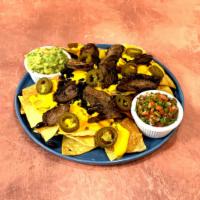 Ranchero Nachos · Freshly fried tortilla chips, nacho cheese, and black beans. Pico de gallo, sour cream, and ...