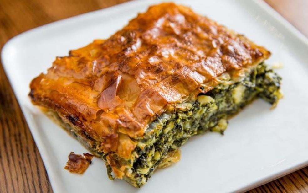 Spanakopita Spinach Pie · Spinach, leeks, dill, scallions and feta cheese in a phyllo dough.
