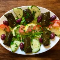 Dolmadakia Grape Leaves · Homemade, hand rolled grape leaves, stuffed with rice and herbs.