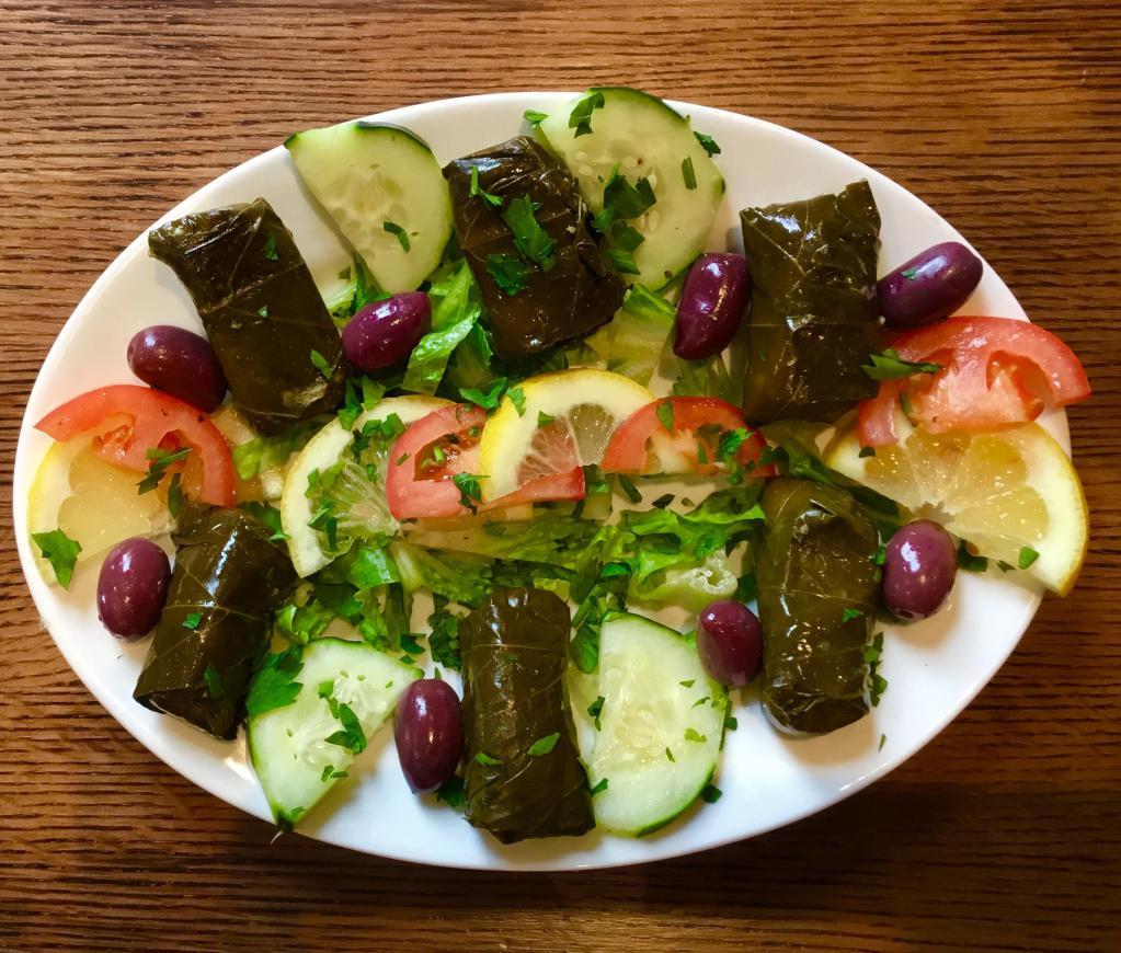 Dolmadakia Grape Leaves · Homemade, hand rolled grape leaves, stuffed with rice and herbs.