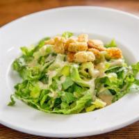 Caesar Salad · Romaine lettuce, croutons, Romano cheese, and creamy Caesar dressing, served with pita bread.