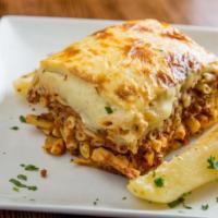 Patitsio · Ground beef, Greek pasta, kefalotyri cheese, béchamel sauce. Served with a choice of soup or...