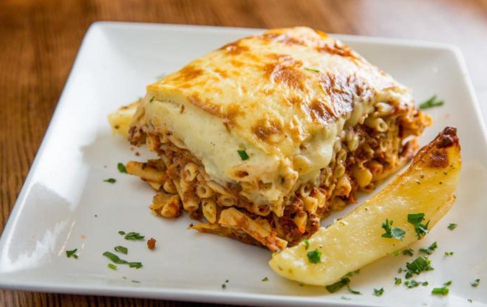 Patitsio · Ground beef, Greek pasta, kefalotyri cheese, béchamel sauce. Served with a choice of soup or salad.