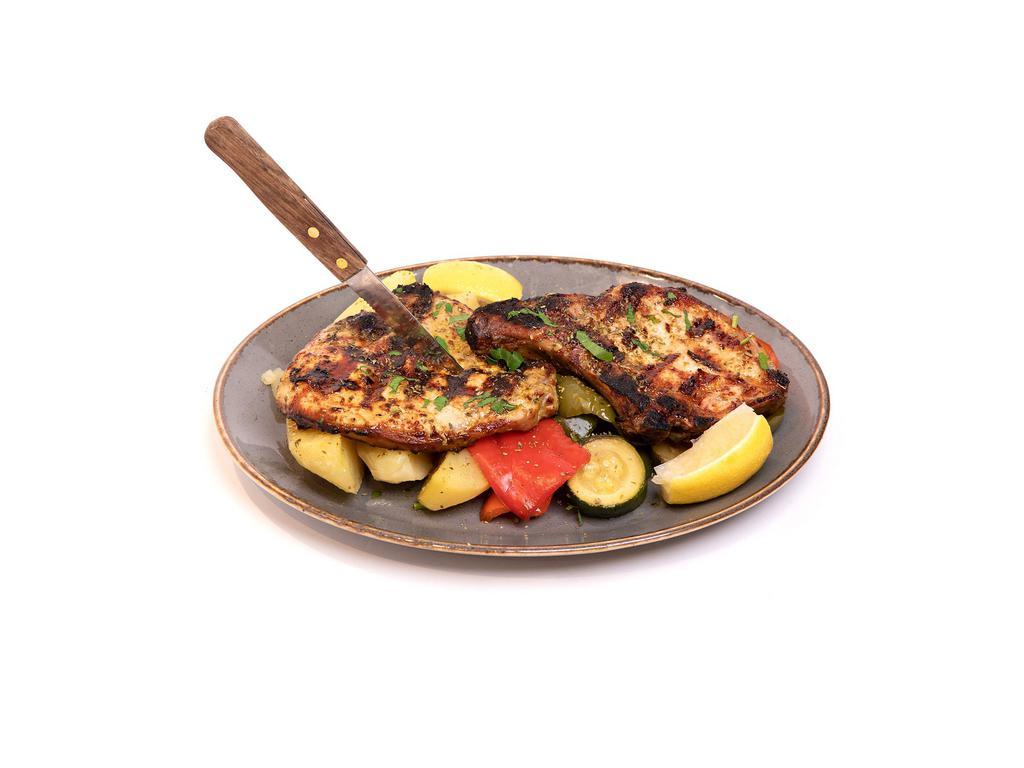 Pork Chops · Grilled pork chops, seasoned with salt and pepper, and finished with oregano. Served with a choice of two sides, and a soup or salad.