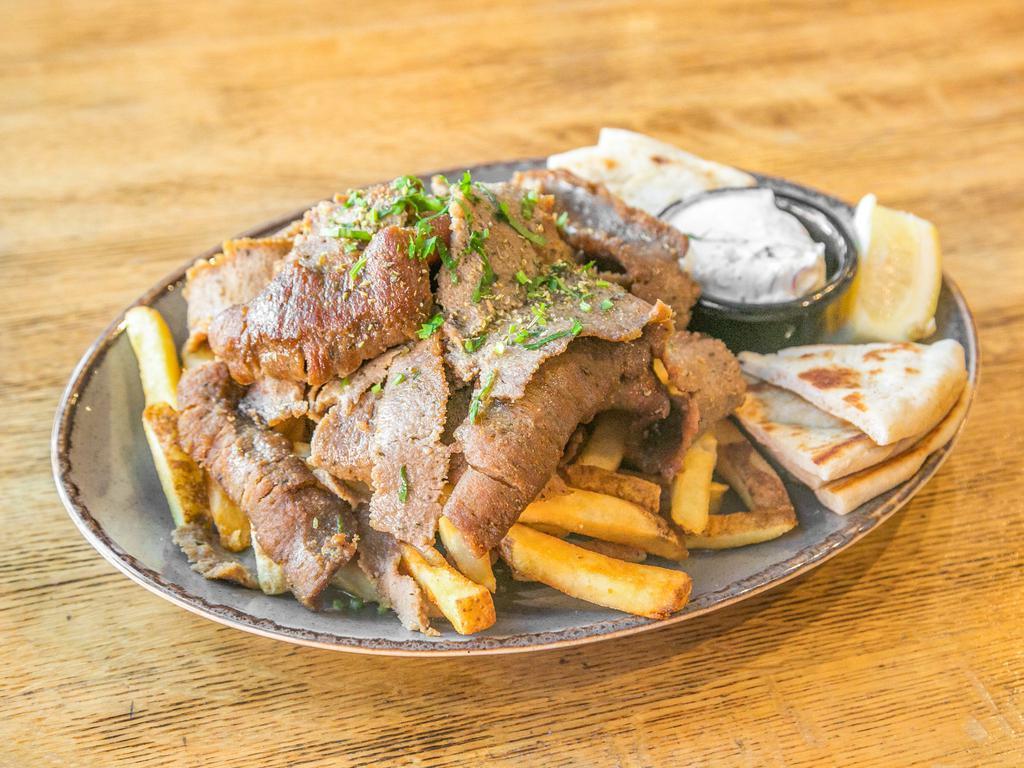 Lamb and Beef (Mix) Gyro Platter · Whole pieces of thinly-sliced lamb and beef.  Served with pita bread, homemade tzatziki sauce, a choice of one side, and a soup or salad.