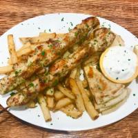 Chicken Souvlaki (Skewers) Platter · Two skewers of marinated chunks of chicken, seasoned with lemon juice.  Served with pita bre...