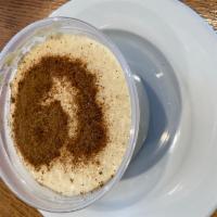 Rice Pudding · Creamy rice pudding topped with cinnamon.